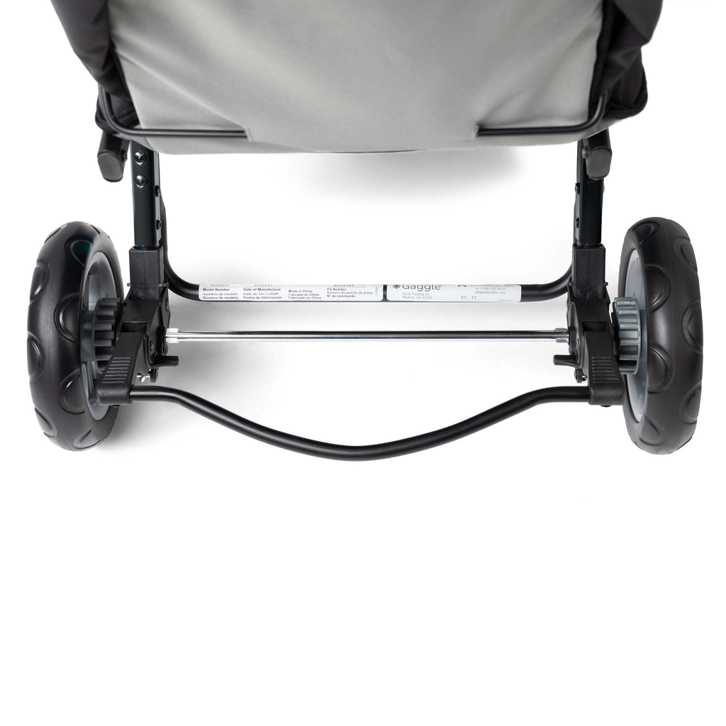 Close-up of a stroller's wheels and brake system 