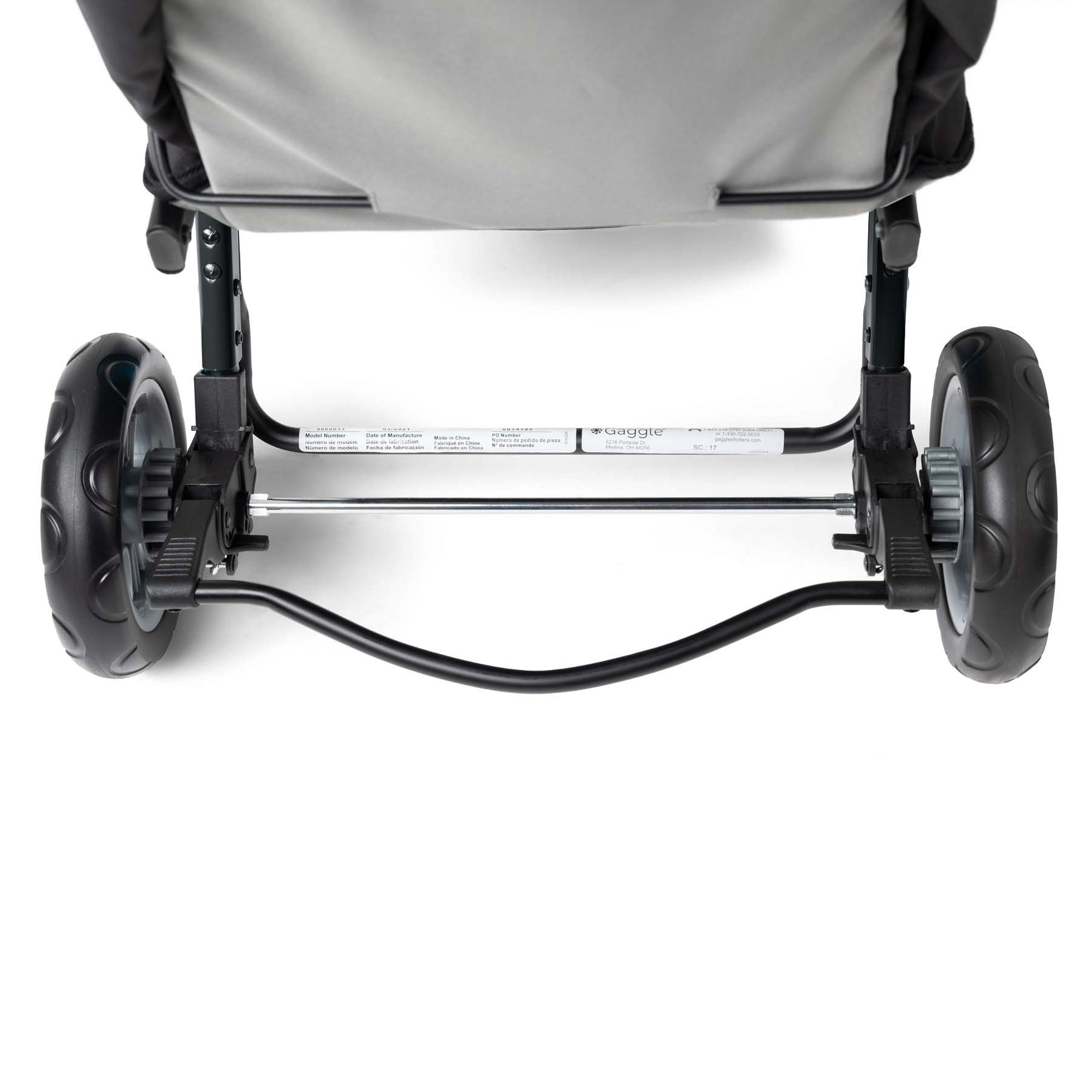 Close-up of a stroller's wheels and brake system 