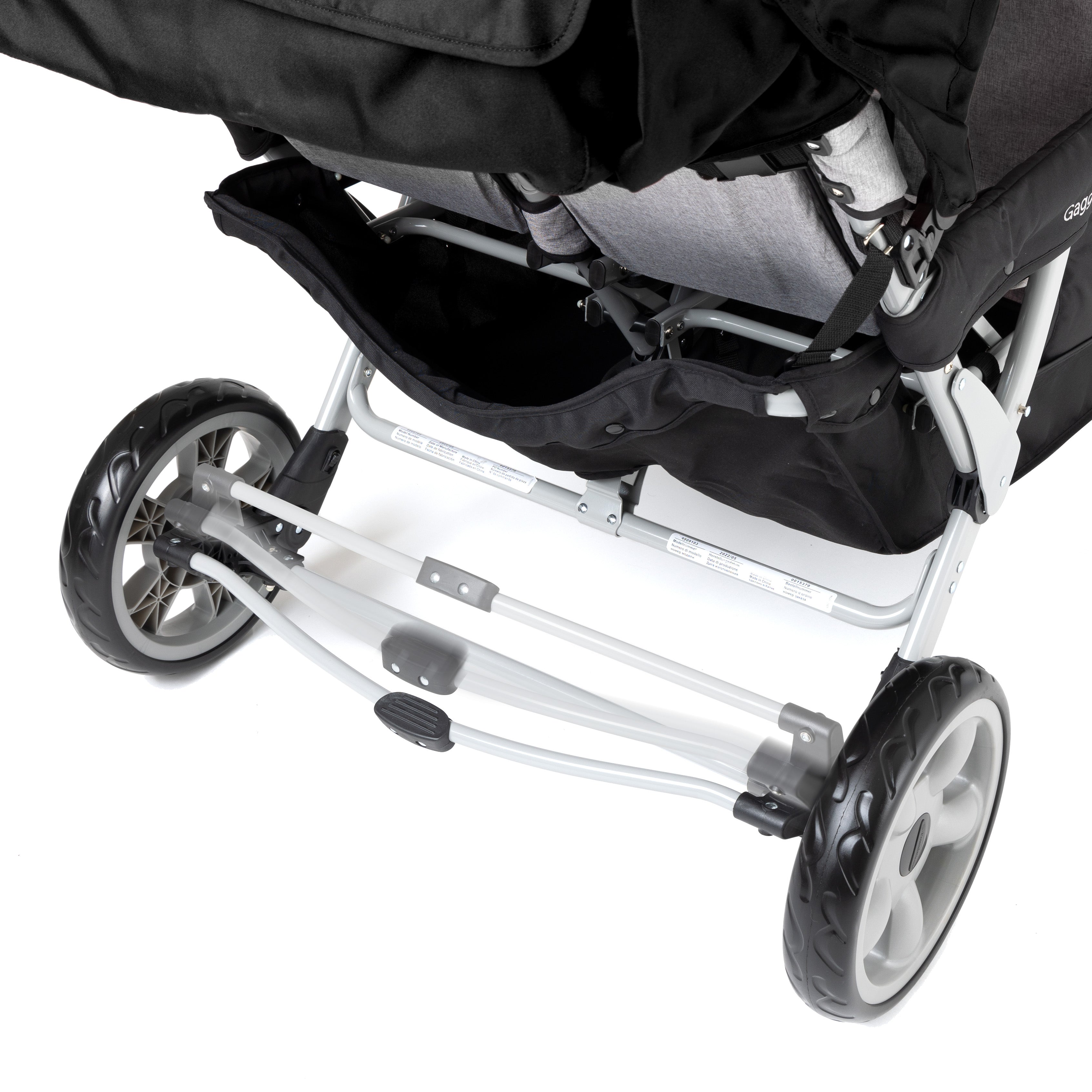 Close-up of a black six stroller foot petal mechanism