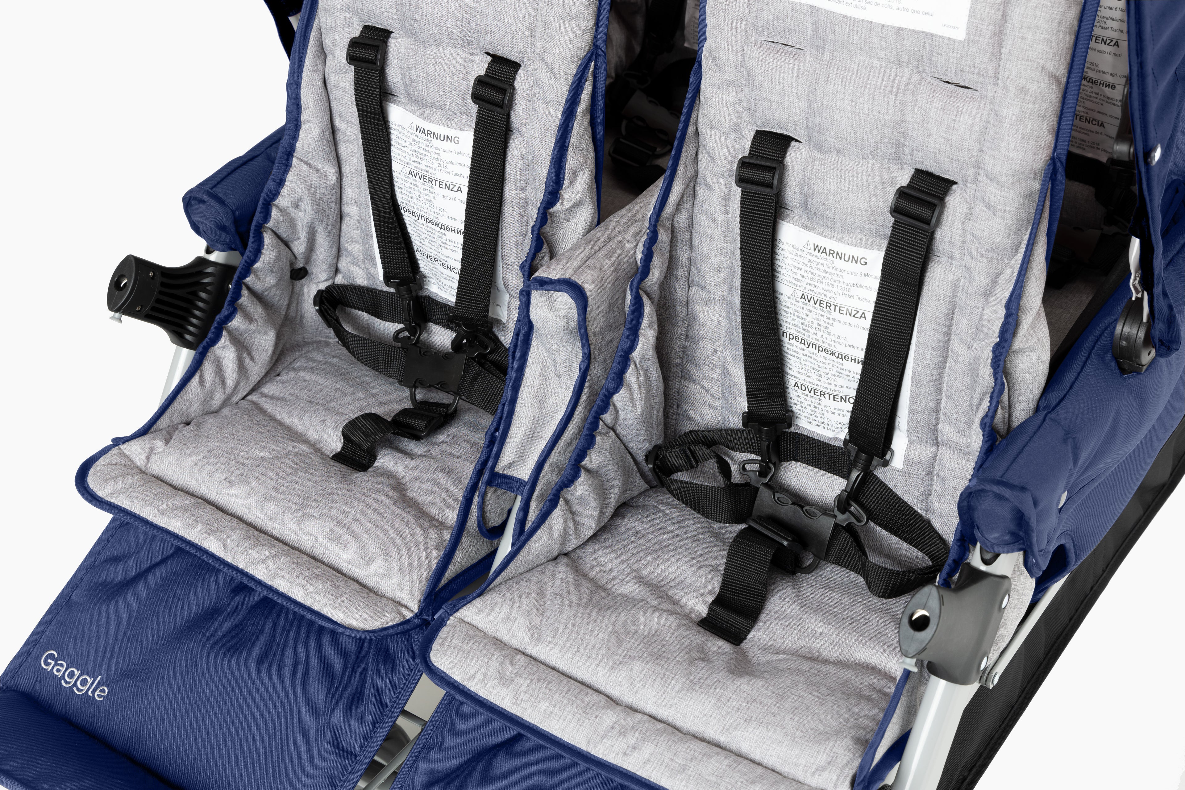 Close-up of blue and gray stroller seats with harnesses