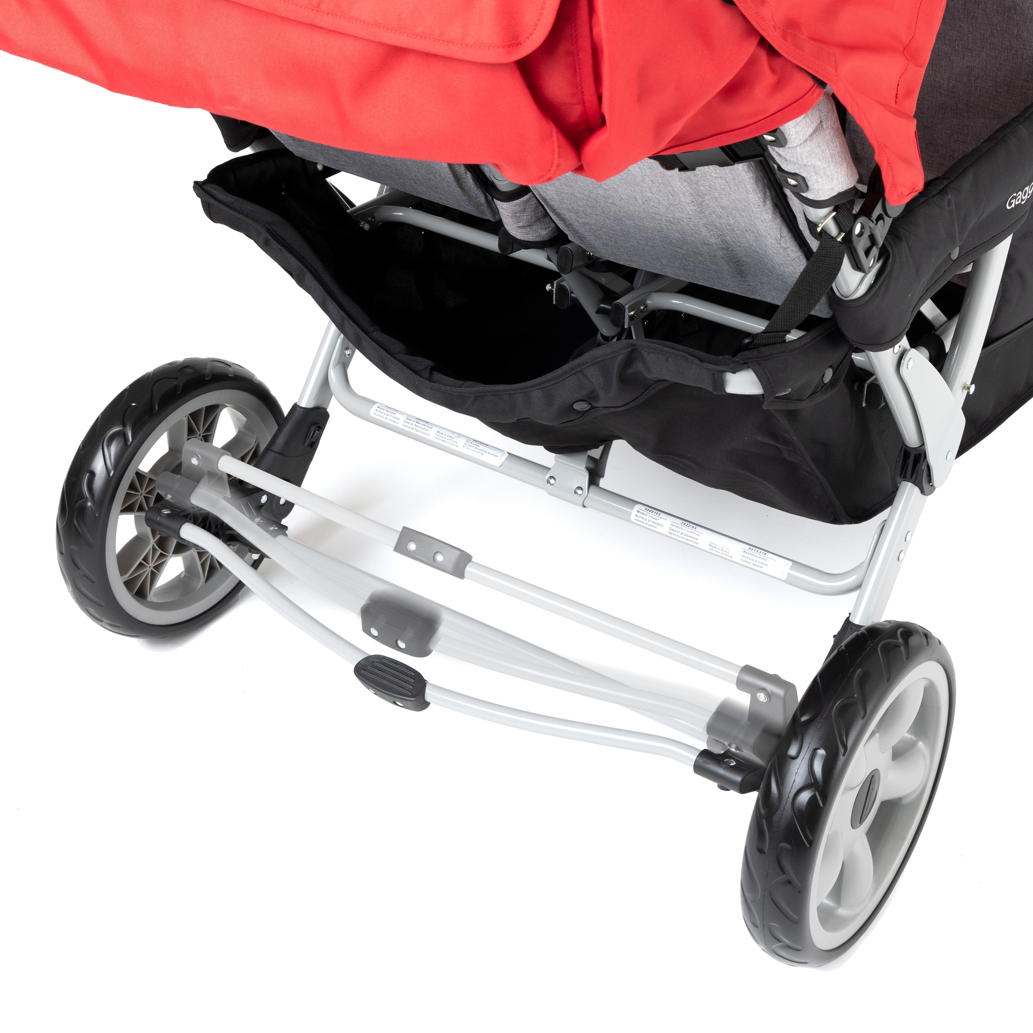 Close-up of a red six seat stroller foot break mechanism