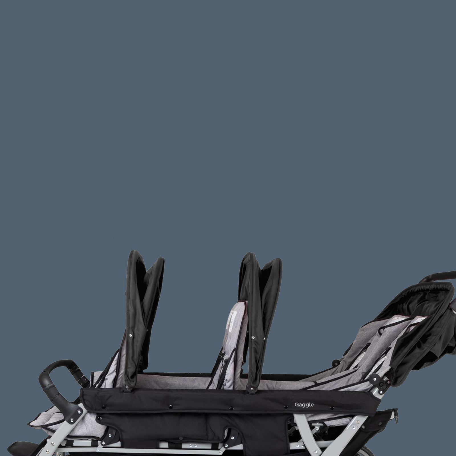 Black and gray stroller on a dark blue background