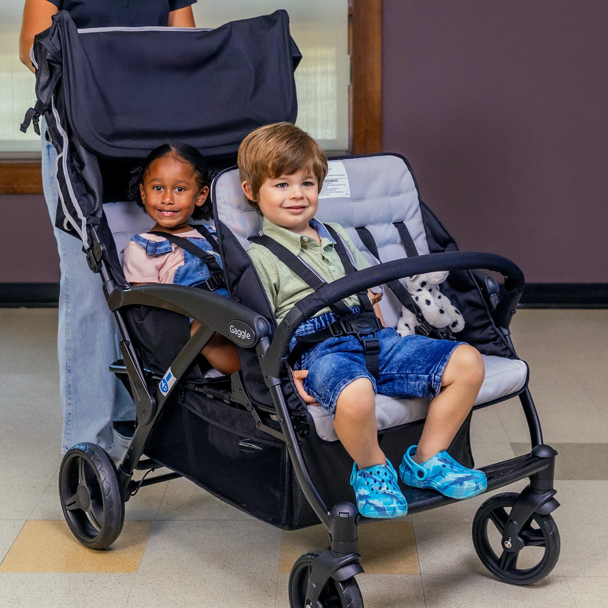 four children stroller inside