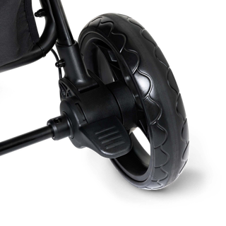 Close-up of a black stroller wheel and foot brake