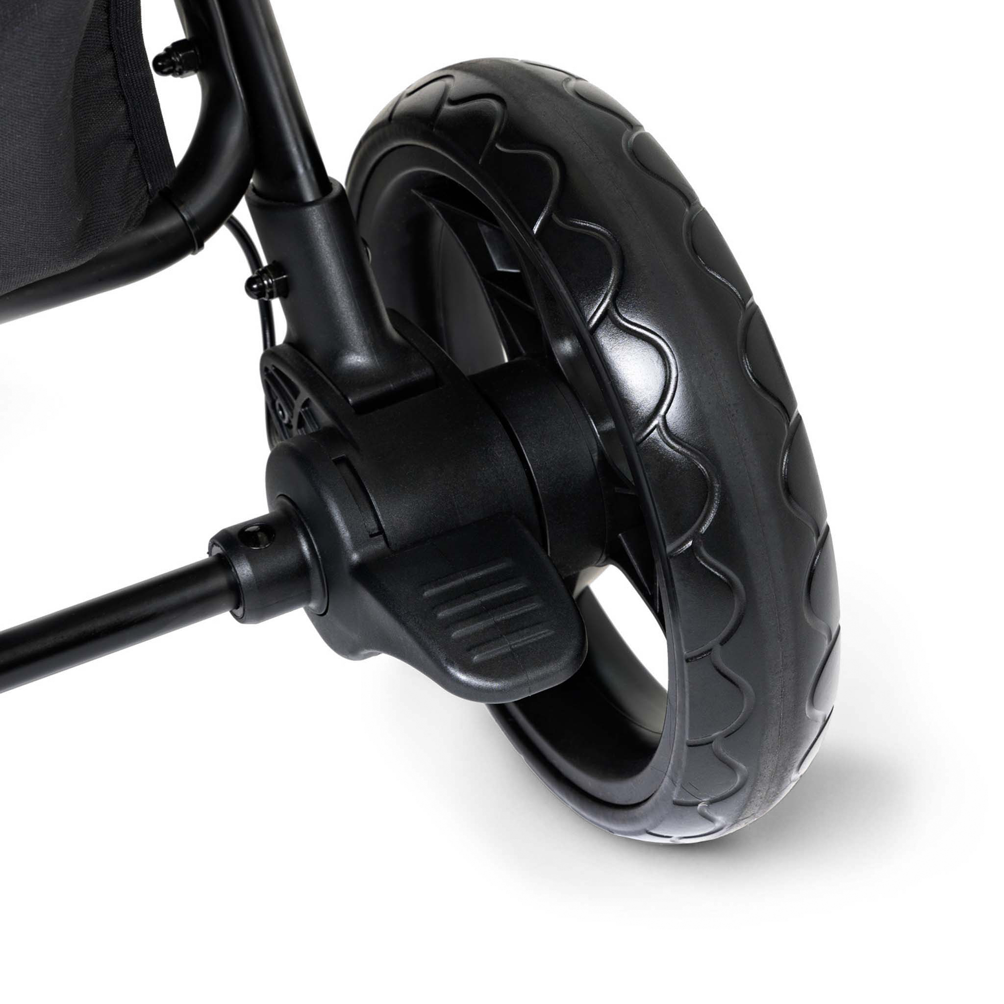 Close-up of a black stroller wheel and foortbrake