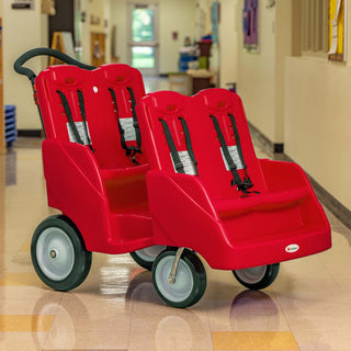Red quad-seated cart with black straps on a tiled floor, likely in an indoor setting.