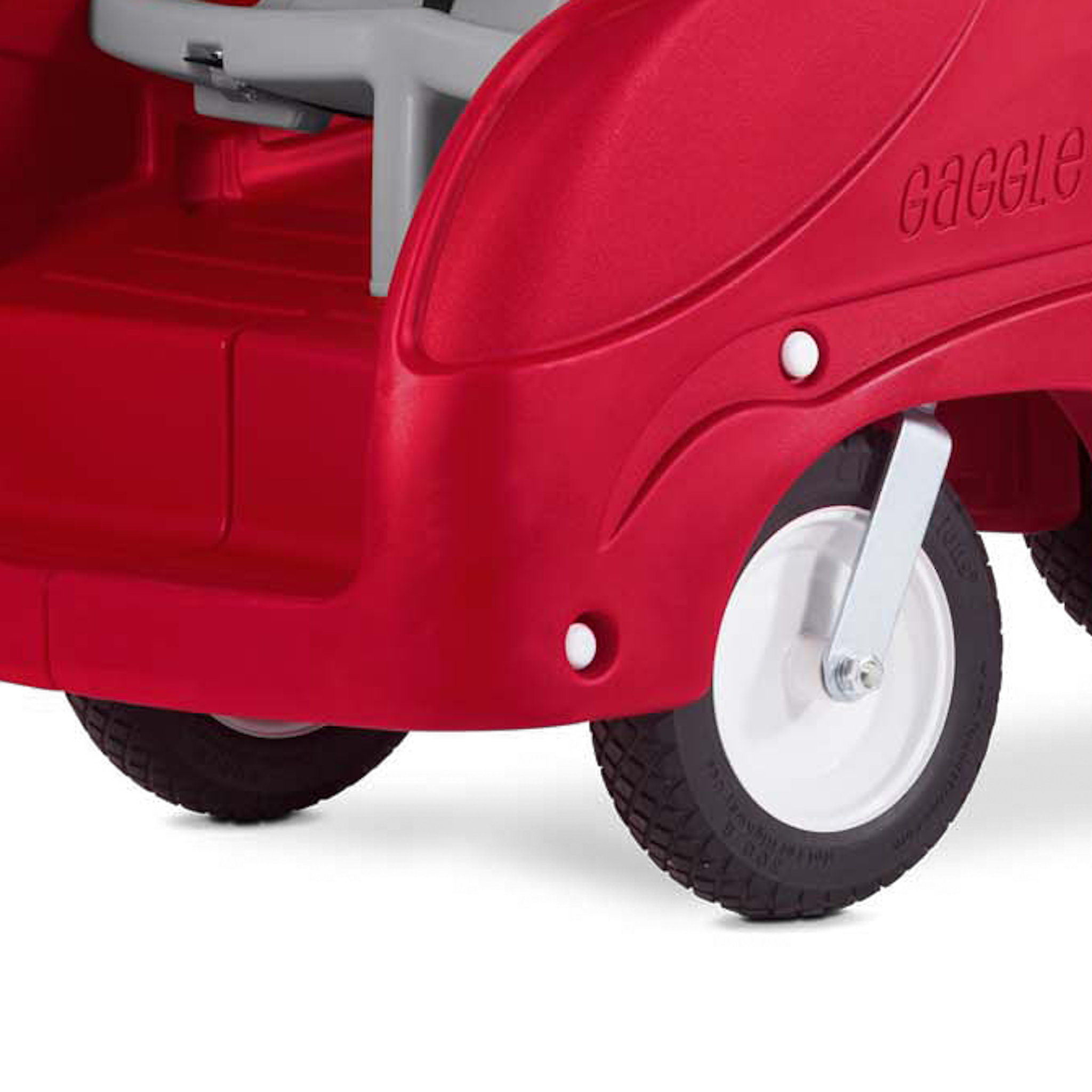 Red six seat buggy with a white wheel