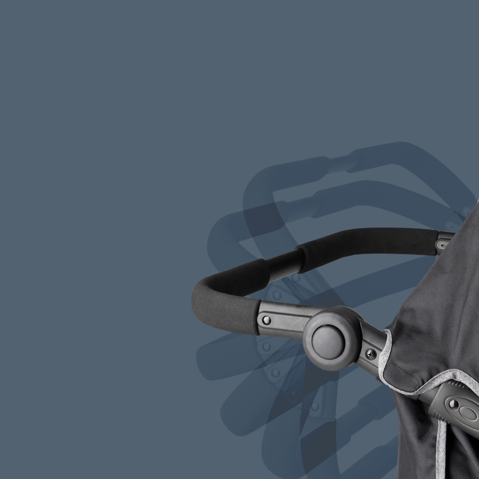 Close-up of a stroller handle on a dark blue background